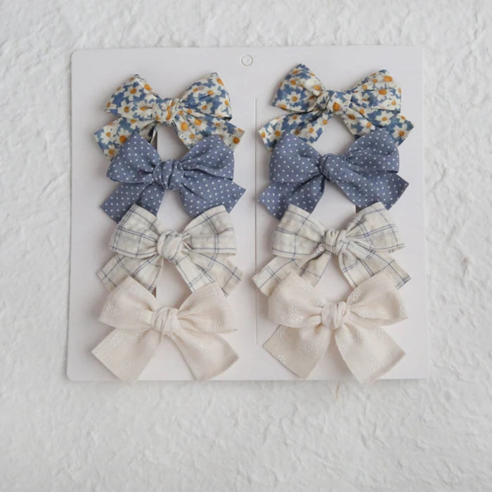 Élégants nœuds en tissu pour cheveux, clips modernes et adorables pour enfants. Ces accessoires couvrent bien les cheveux et sont confectionnés en tissu doux et tendance.