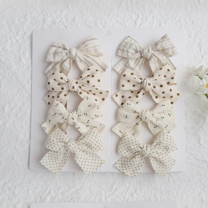 Élégants nœuds en tissu pour cheveux, clips modernes et adorables pour enfants. Ces accessoires couvrent bien les cheveux et sont confectionnés en tissu doux et tendance.
