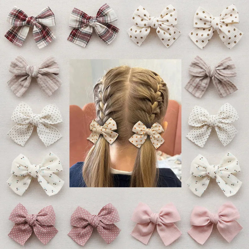 Élégants nœuds en tissu pour cheveux, clips modernes et adorables pour enfants. Ces accessoires couvrent bien les cheveux et sont confectionnés en tissu doux et tendance.