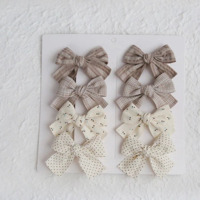 Élégants nœuds en tissu pour cheveux, clips modernes et adorables pour enfants. Ces accessoires couvrent bien les cheveux et sont confectionnés en tissu doux et tendance.