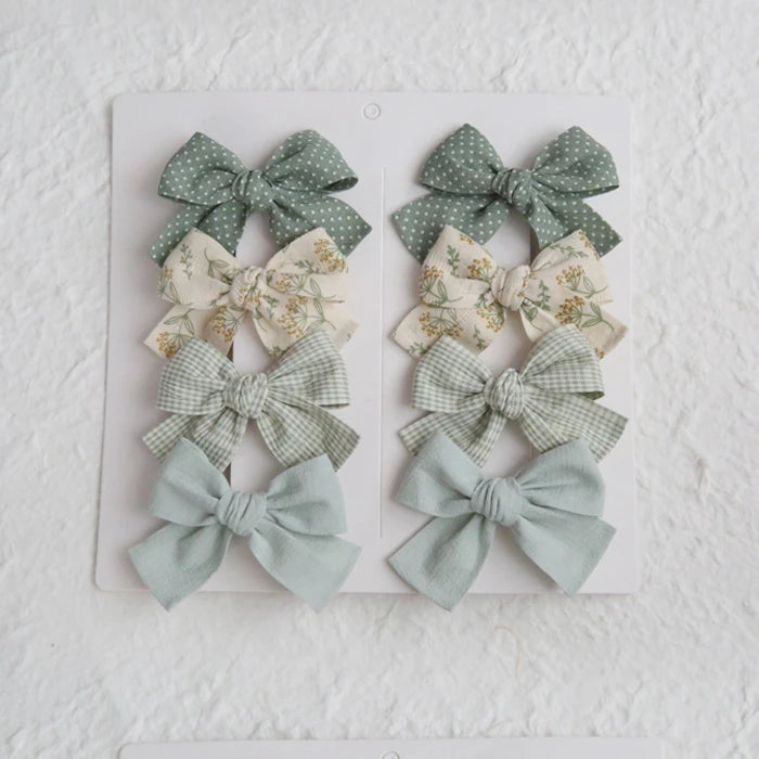 Élégants nœuds en tissu pour cheveux, clips modernes et adorables pour enfants. Ces accessoires couvrent bien les cheveux et sont confectionnés en tissu doux et tendance.