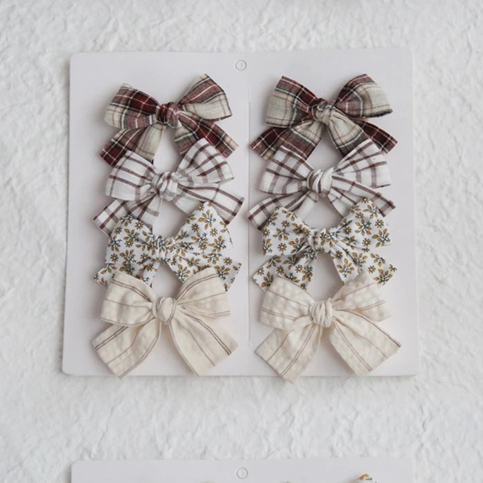 Élégants nœuds en tissu pour cheveux, clips modernes et adorables pour enfants. Ces accessoires couvrent bien les cheveux et sont confectionnés en tissu doux et tendance.